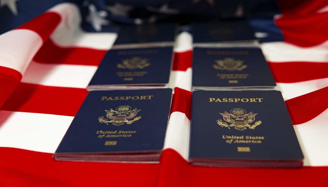 U.S. flag with passports on top