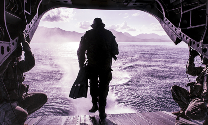 Solider walking off back of plane