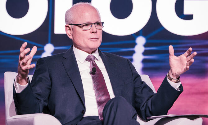 Tom Bell speaking at an event