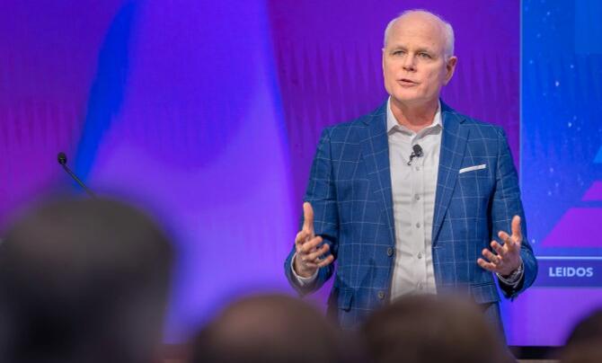 Leidos CEO Tom Bell addressing audience
