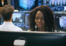 Infrastructure support analyst at work in operations center