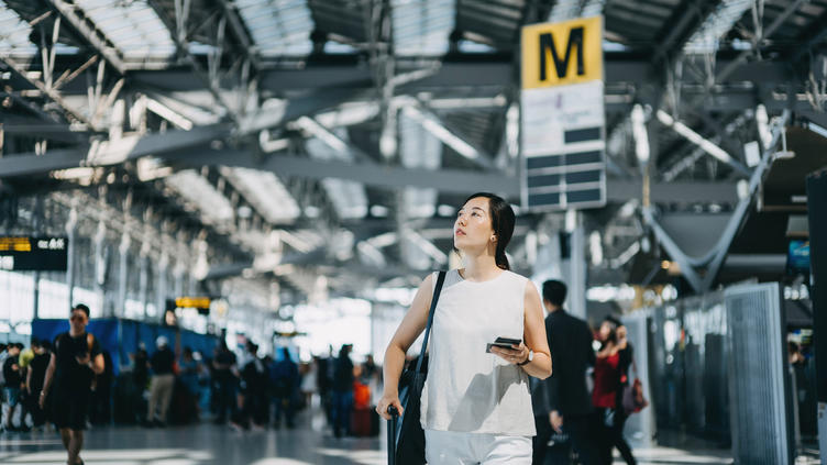 woman walking through airport 